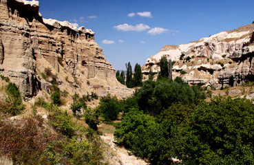 Fototapeta na wymiar Amazing mountains in the Pigeon Valley near the towns of Goreme and Uchisar in Cappadocia, Turkey