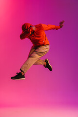 Fototapeta na wymiar African man jumping high isolated over pink background