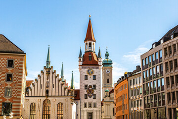 View at the tower of the old town hall and toy museum at Marienplatz pedestrian zone in munich city downtown - obrazy, fototapety, plakaty
