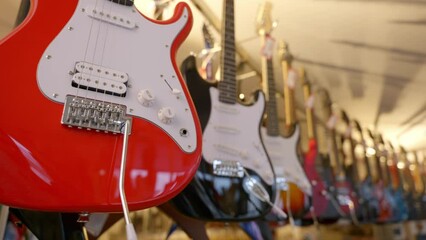 a lot of vintage electric guitars in the interior of a music store
