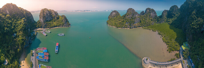 Aerial view floating fishing village and rock island, Ha Long Bay, Vietnam, Southeast Asia. UNESCO World Heritage Site. Junk boat cruise to Ha Long Bay © CravenA