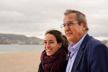 Obraz premium family of adult father and daughter looking at the landscape. Father's day