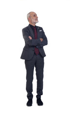 front view of a man standing with suit and looking up on white background