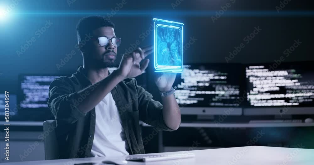Poster Man, programming and futuristic hologram at night on computer dashboard or software application at office. Male programmer working late on future AI technology or virtual app for UI or UX overlay