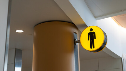 Men's restroom sign at airport 