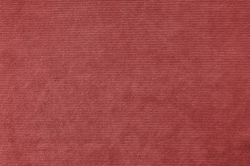 Texture background of velours red fabric. Upholstery velveteen texture fabric, corduroy furniture textile material, design interior, decor. Ridge fabric texture close up, backdrop, wallpaper.