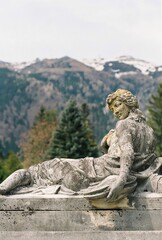 statue and the mountains 