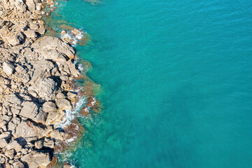 Stunning Aerial View of Mediterranean Blue Waters and Stone Cliffs - A Breathtaking Coastal Landscape