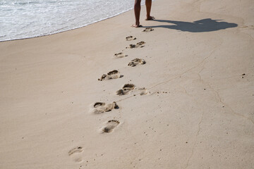 footsteps in golden sand texture summer fun