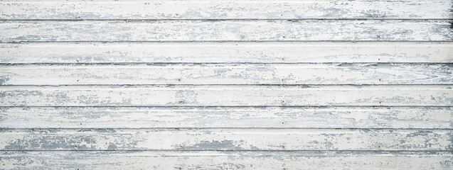 Old house exterior with old wooden boards. White painted wood siding with antique finish.
- 581213775
