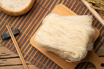 Thai died White Rice Vermicelli on wooden board,Uncooked.Top view