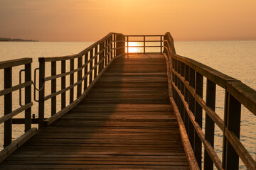 Fototapeta na wymiar Scenic jetty with golden morning liaght, seascapes