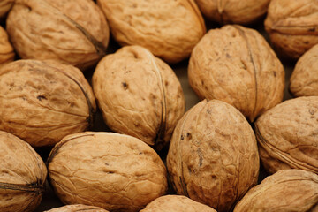 Walnut close up on a wooden table. Walnut close up. product rich in minerals and vitamins.