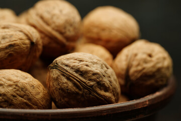 Walnut close up on a wooden table. Walnut close up. product rich in minerals and vitamins.
