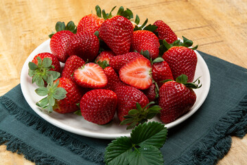 New harvest, board with fresh ripe red sweet Spanish strawberry