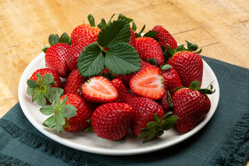 New harvest, board with fresh ripe red sweet Spanish strawberry