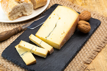Cheese collection, French Morbier semi-soft cow milk cheese with black mold layer