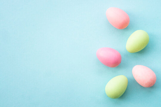 Easter eggs at green background. Flat lay image with copy space.