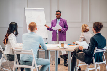 African american businesswoman holding a presentation during a meeting in an office