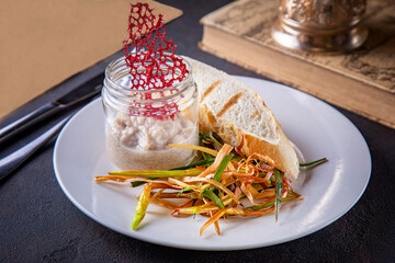 Sauce in a jar with a slice of bread