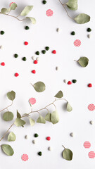 Eucalyptus Twigs in a Flat Lay on off White Paper with an Envelope, Candy and Sweets