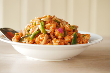 cashew nut salad on a plate on table 