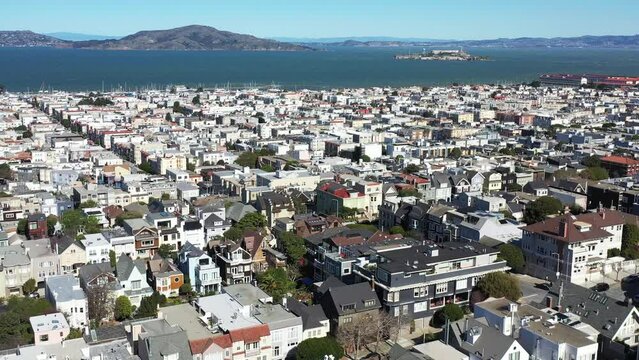 
Seaside San Francisco residential neighborhood with Alcatraz Prison and Island in distance - 4K Drone