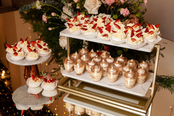 Reception Hall Decorated For Social Events; Dessert Table For Guests