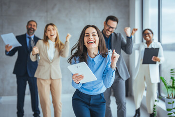 Team Huddle Harmony Togetherness Happiness Concept. Group of joyful excited business people throwing papers and having fun in office. Group of team creative business people 
