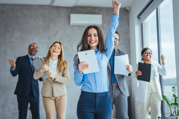 Portrait of overjoyed young diverse employees workers show thumb up recommend good quality company service. Smiling multiethnic colleagues celebrate shared business success or victory in office