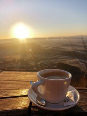 cup of coffee in sunset