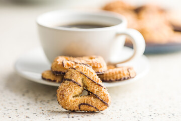 Assorted various cookies. Sweet biscuits and coffee cup.