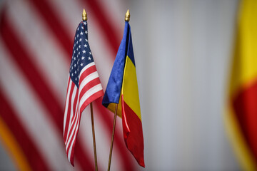 United States of America and Romania's flags are seen during a press conference
