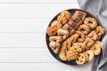 Assorted various cookies. Sweet biscuits on plate. Top view.