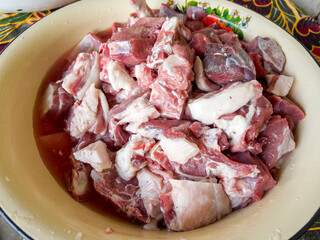 The washed lamb and beef in the bowl.