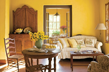 A sundrenched room comes alive with yellow painted walls rustic wooden furniture and cheerful floral accents. Interior decoration. AI generation.