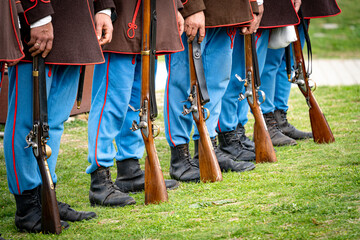 Row of 19th century uniformed hungarian soldiers with rifles