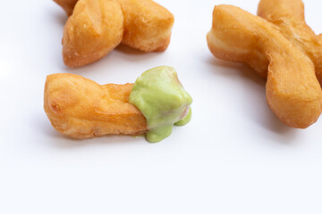 Deep-fried dough sticks or chinese bread sticks with with pandan custard dip