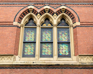 Fototapeta na wymiar Stained glass windows of Memorial Hall building, Cambridge Street, Cambridge city, Massachusetts, USA