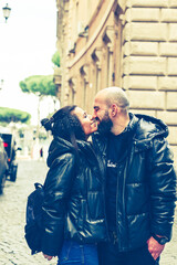 Happy  Tourists  couple traveling at Rome, Italy,   Hugging  on the streets of , Rome, Italy Concept of Italian travel. 