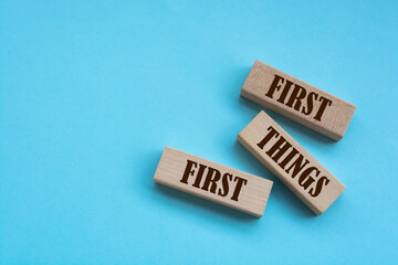 First Things First - words from wooden blocks with letters, Business concept	