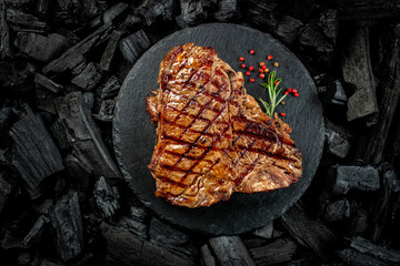 Beef T-bone steaks on BBQ grill coal. porterhouse steak or T Bone Steak. Restaurant menu, cookbook recipe. place for text, top view