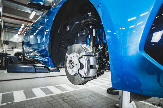Lima, Peru; March 2020: Cleaning and maintenance of the disc brake system of a European car BMW
