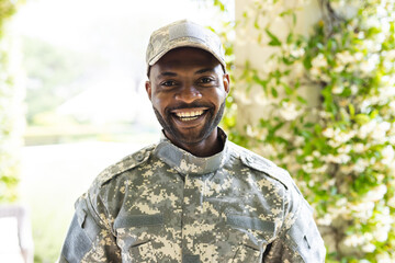 Portrait of happy african american male soldier looking at camera and smiling