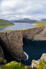 Lake above the ocean trail in Faroe Islands