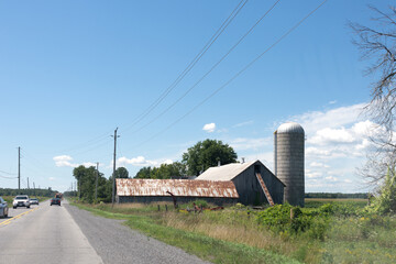 Fototapeta na wymiar Abandoned farm near the road