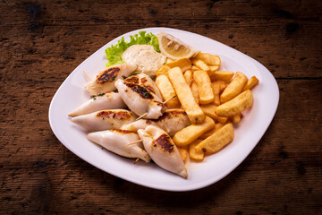 plate with stuffed squid and french fries