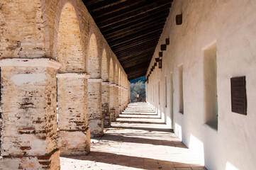 Mission hallway columns and shadows