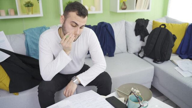 Lazy and messy man thoughtful.
Lazy man with undisciplined and relaxed lifestyle thoughtful at home.
