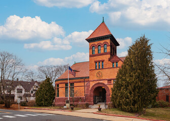 The old part of the Plumb Memorial Library in Shelton, CT is recognizable for its unique Romanesque architecture